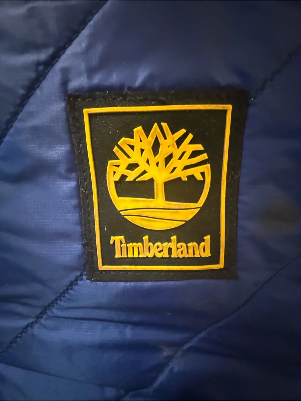 Timberland Blue and Black Quilted Roll-Top Backpack